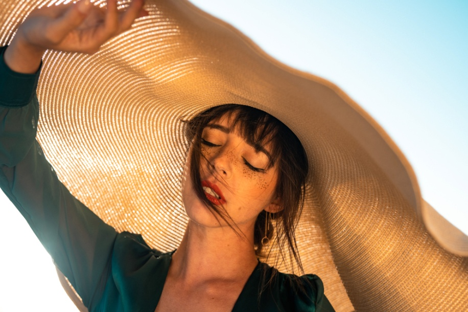  A woman wearing a big brown hat