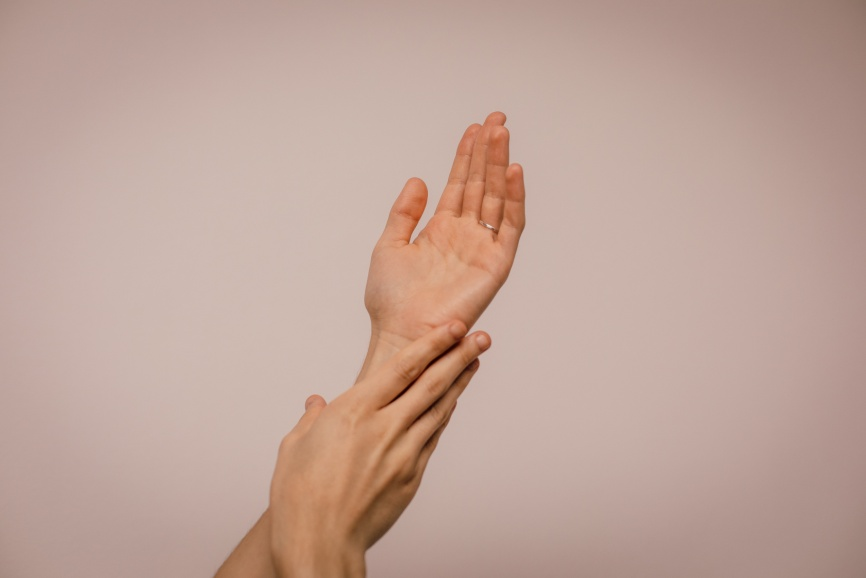 Person touching their hands