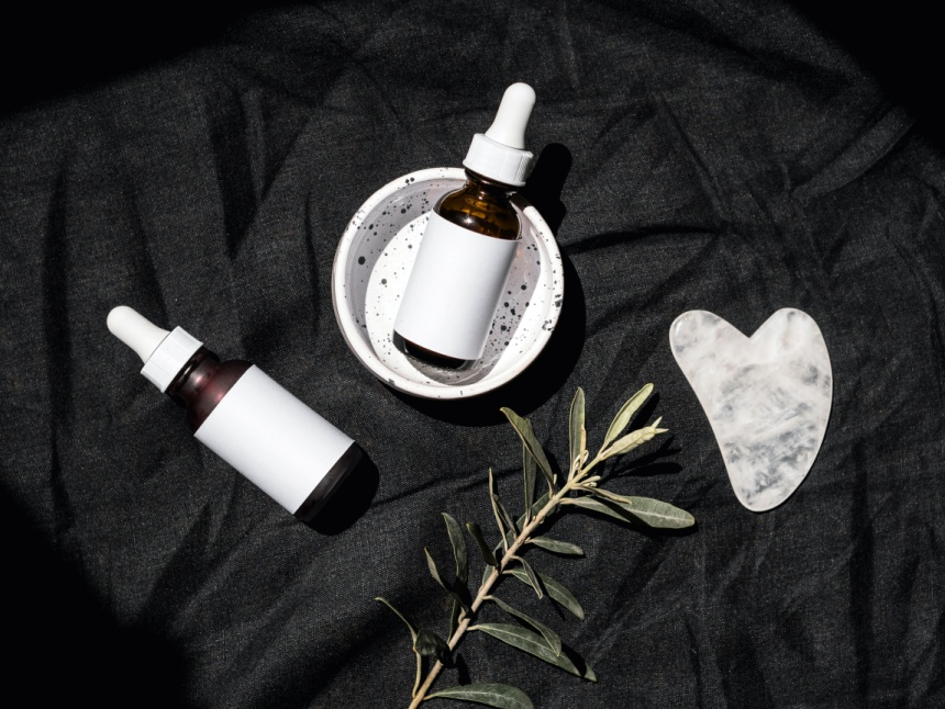 serum bottles on black background