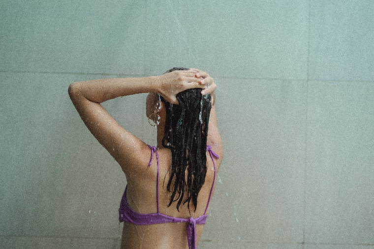A person washing their hair
