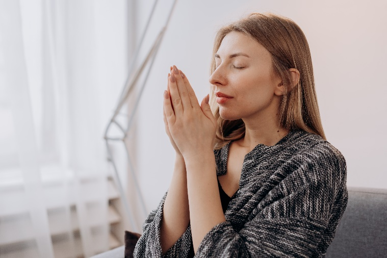A person with fresh and healthy skin relaxing with their eyes closed