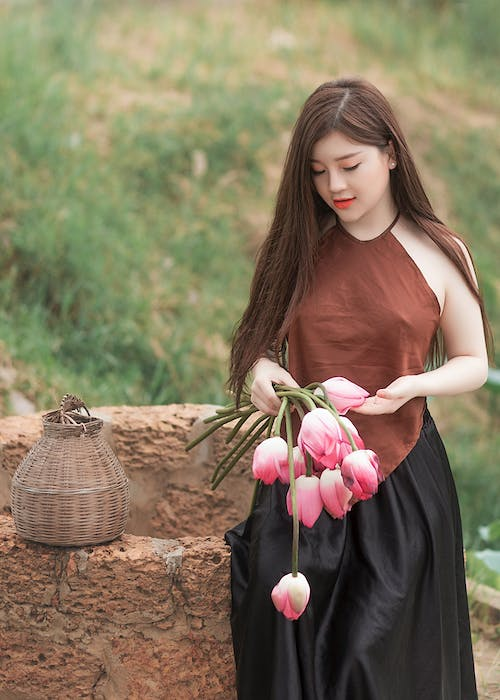 A woman holding flowers