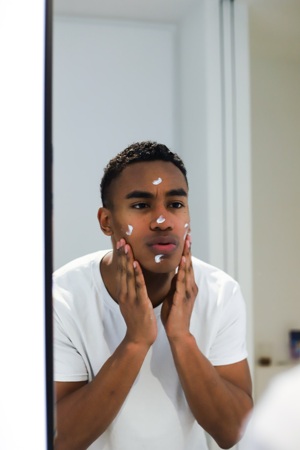 a man doing his skin care
