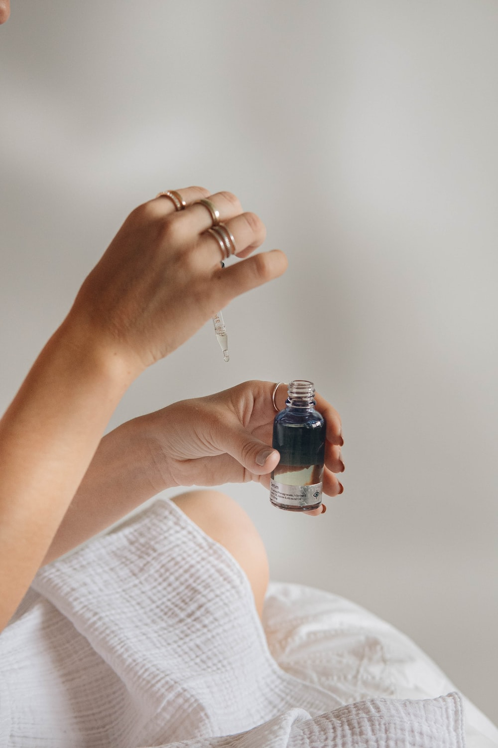 a woman using a serum
