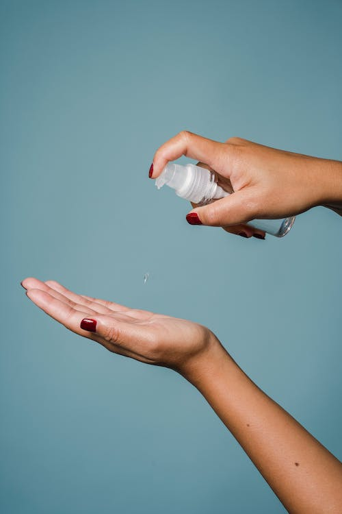 A bottle of lotion against a blue background